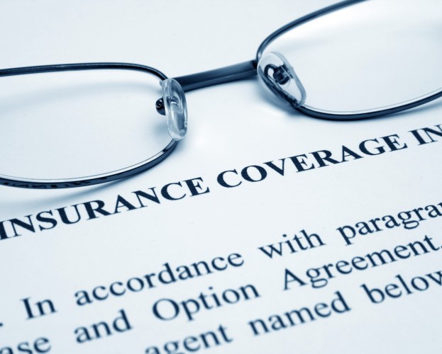 Black framed glasses on a closeup of Insurance Coverage Info