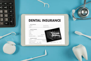 Dental insurance and X-ray on tablet