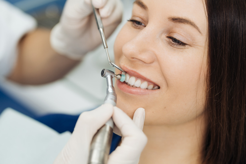 Patient smiling at dentist after getting dental crowns